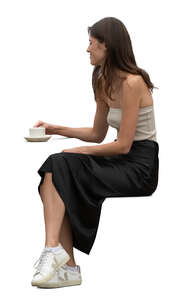 woman sitting and drinking coffee