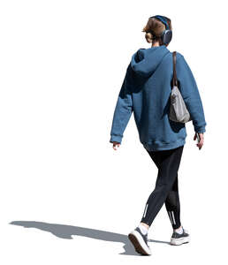 cut out woman with headphones walking