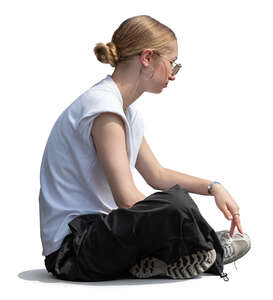 cut out teenage girl sitting on the ground