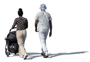 man and woman with a baby stroller walking