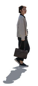 cut out backlit young korean woman walking