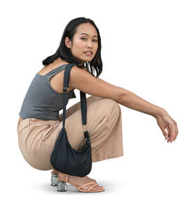 cut out asian woman squatting