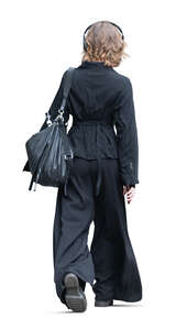 young woman in black and listening to music walking