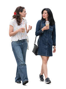 two spanish women with coffee cups walking