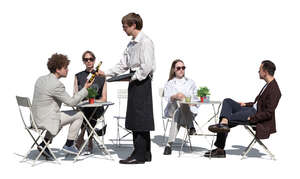 outdoor restaurant with a waiter showing wine to customers