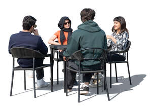 group of young middle eastern people sitting in a cafe