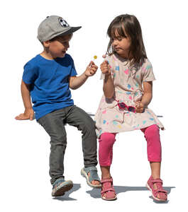 two children eating candy