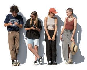 group of young people leaning against the wall