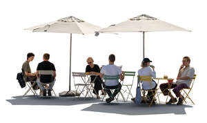cut out backlit scene of people sitting in a street cafe