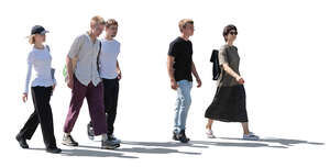 backlit group of young people walking