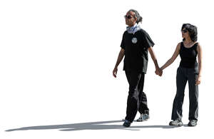 backlit image of and indian couple walking hand in hand