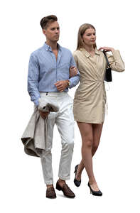 young couple in fancy outfits walking arm in arm