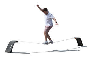 cut out man walking on a slackline