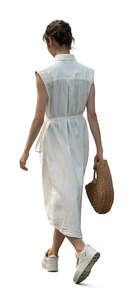 asian woman in a white dress walking