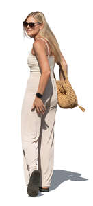 woman walking and looking back over her shoulder