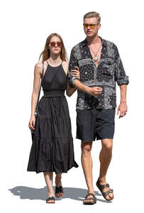 man and woman walking on sunny summer day
