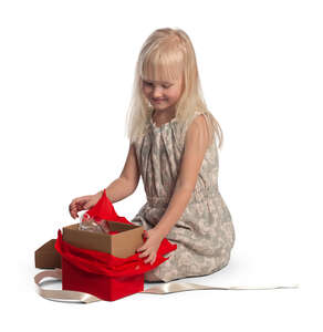 little girl opening a present