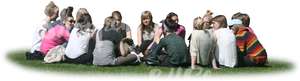 large group of people sitting on the grass