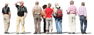 eight elderly people standing and looking around