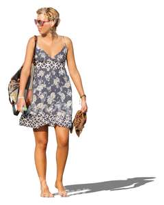 woman in a summer dress walking barefoot