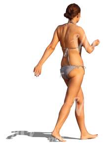 woman in a bikini walking barefoot