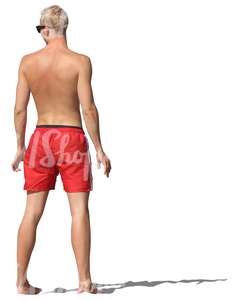 man in swimming pants standing barefoot