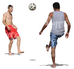 two men playing football at the beach