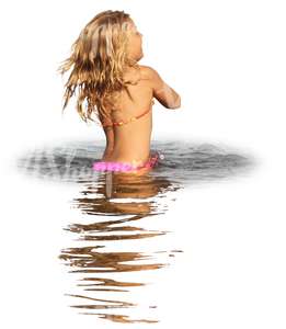 young girl playing in the water