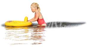 young girl with a toy playing in the water