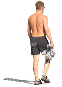 man in swimming pants walking