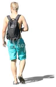 blond man in swimming pants walking