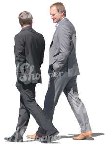 two men in formal suits walking