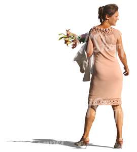 woman in a beige party dress and flowers