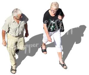 elderly man and woman walking