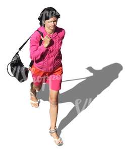 woman in pink clothes walking