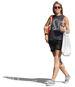 woman with sunglasses and groceries bag