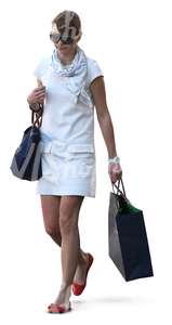 woman walking with a shopping bag in her hand