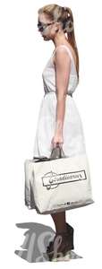 woman in a white dress and with a big shopping bag