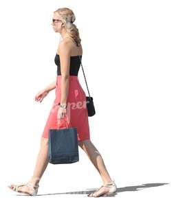 woman with a shopping bag walking