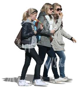 three girls walking and eating ice cream