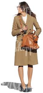 woman with a brown coat standing