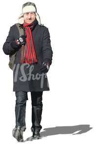 man with a red scarf walking