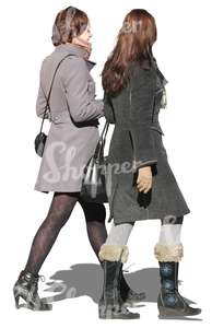 two women in autumn coats walking together