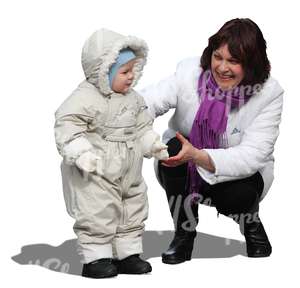 woman playing with a small child in winter