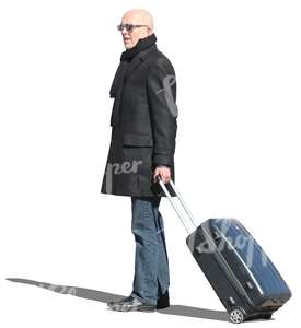 travelling man standing with a suitcase