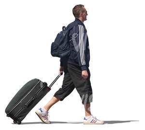 man walking and pulling a suitcase