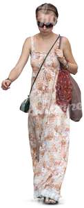 cut out woman in a long summer dress walking