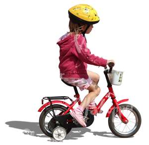 little girl with helmet riding a bike