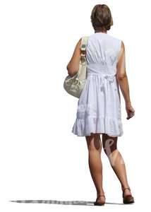 cut out woman in a white summer dress standing