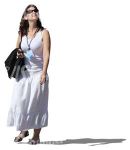 cut out woman in a white dress walking